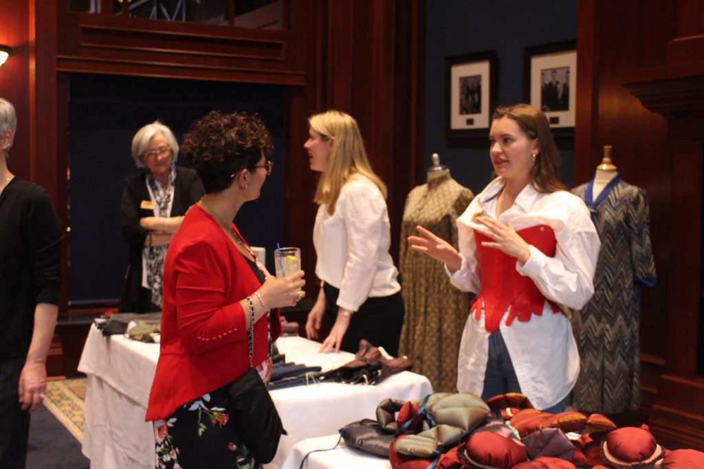 Heritage Park's costumers discussing corsets with event attendees