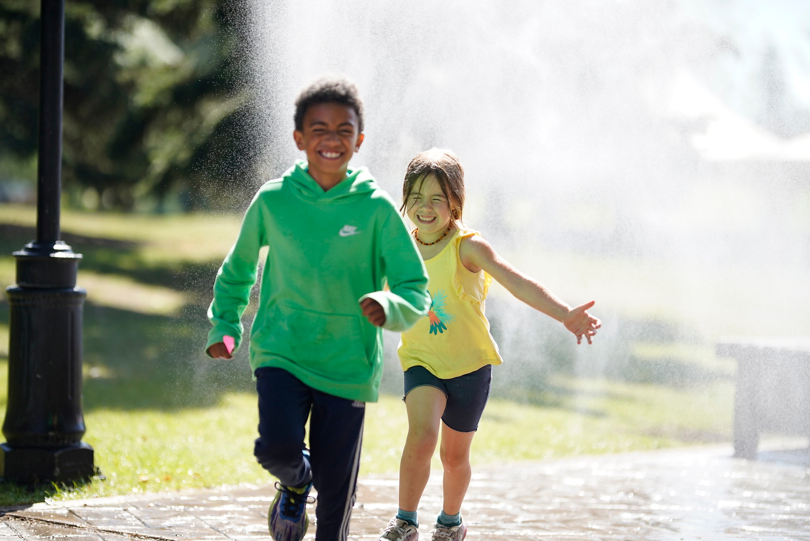 Kids Running in Sprinkler