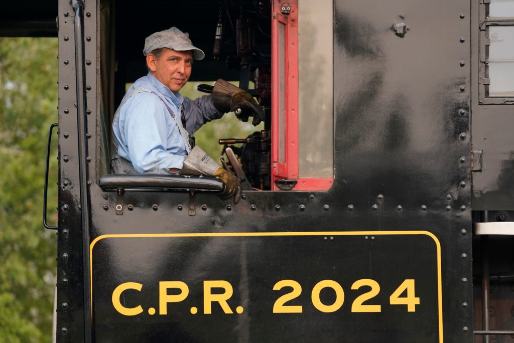 Conductor of train smiling railway days