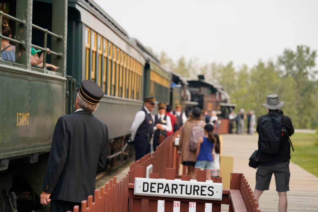 Side of the train with departures sign railway days