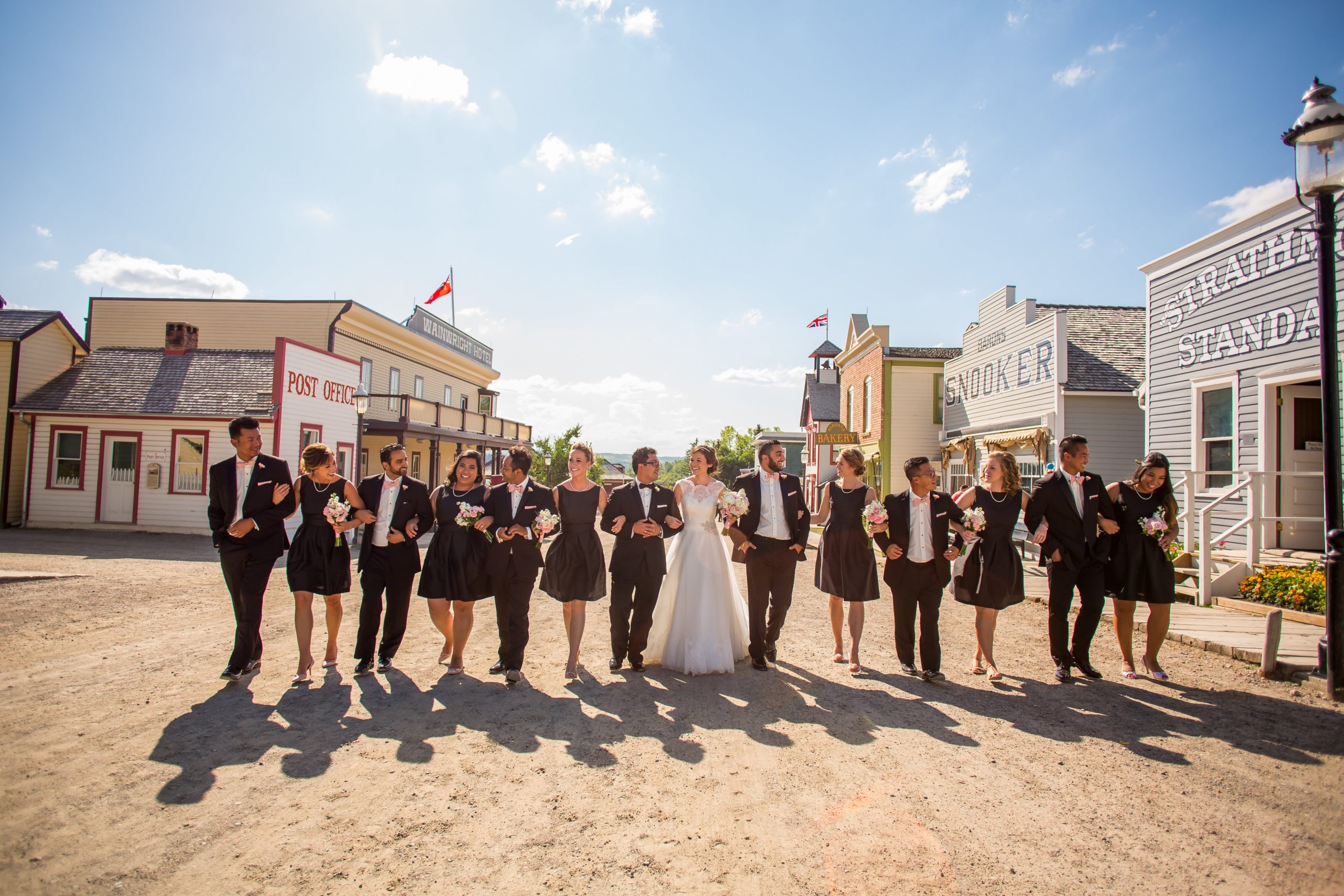 Wedding Party strolling through main street of Heritage Park Historical Village