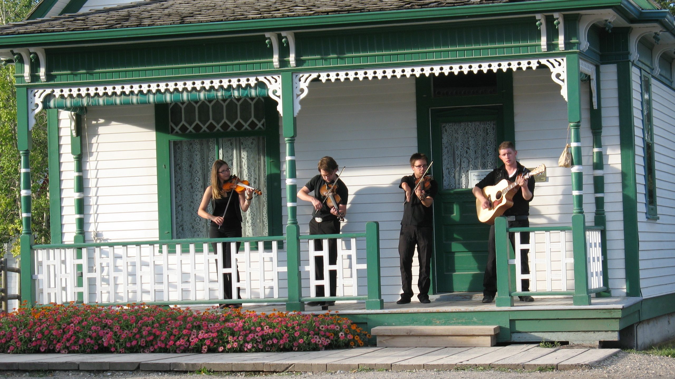 A group of professional fiddlers perform at a private event at Heritage Park