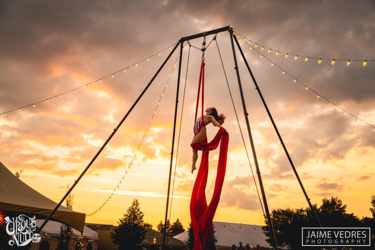Guests enjoy a fun night out in Calgary while watching performances by Le Cirque de la Nuit at Heritage Park