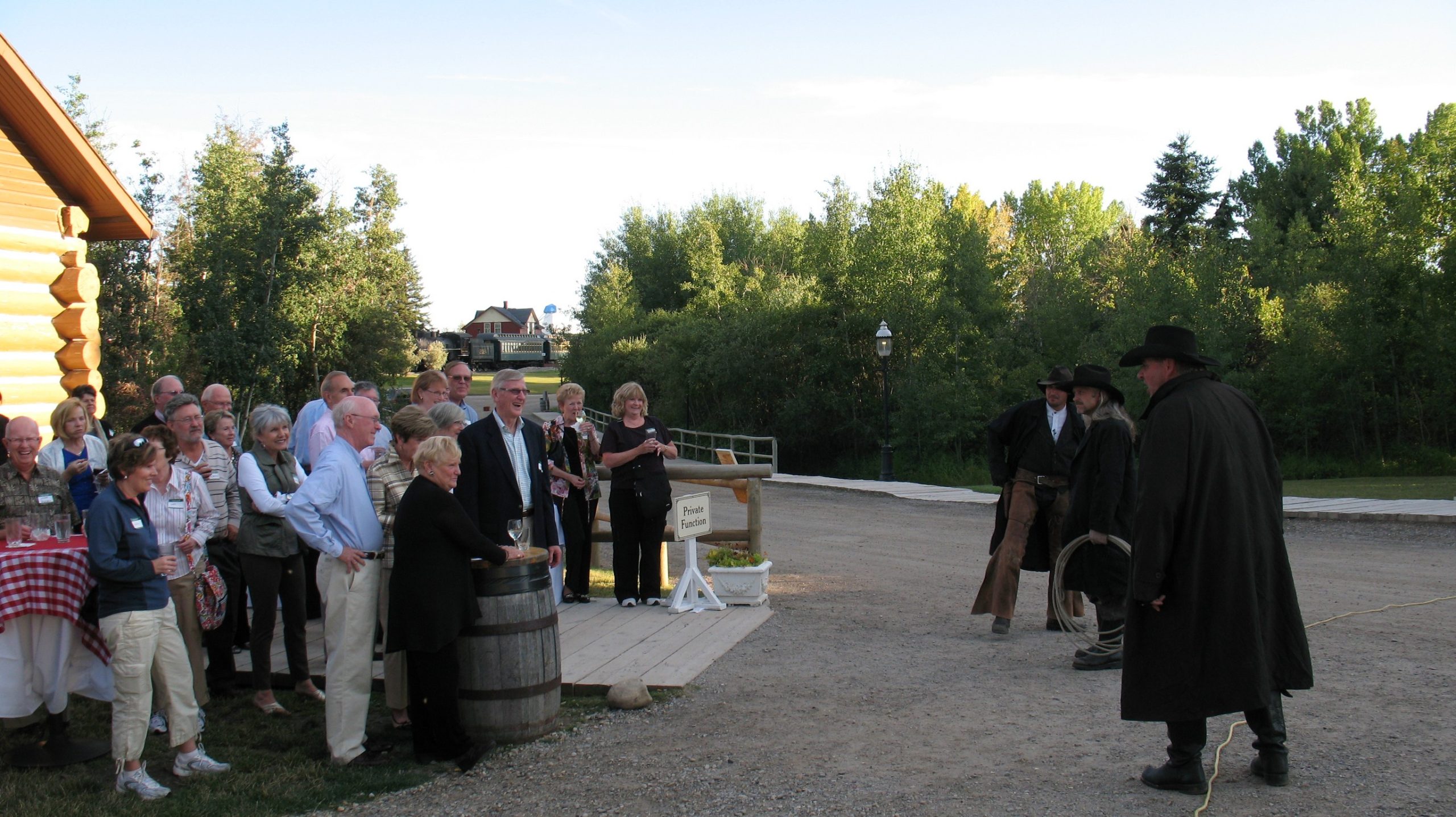 Gunfighters talk with private event goers at Heritage Park