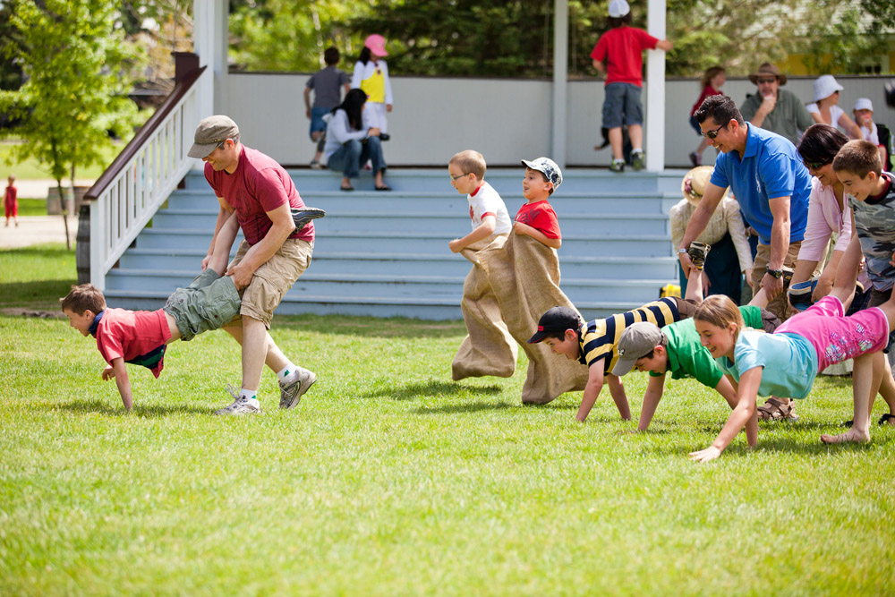 Families have fun in potato sack & wheelbarrow races at Heritage Park