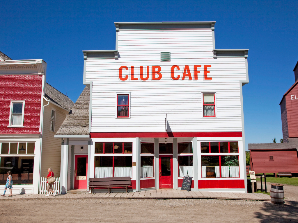 large white building that says Club Cafe