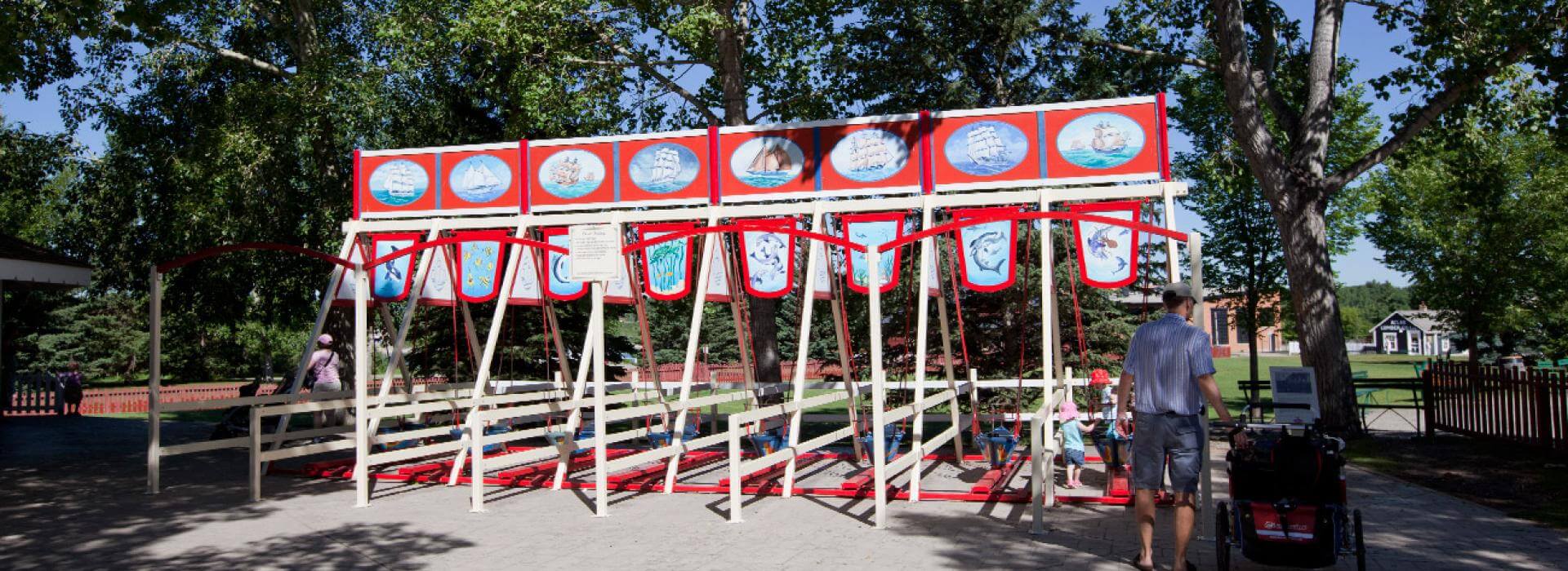 8 swings side by side in the amusement park 