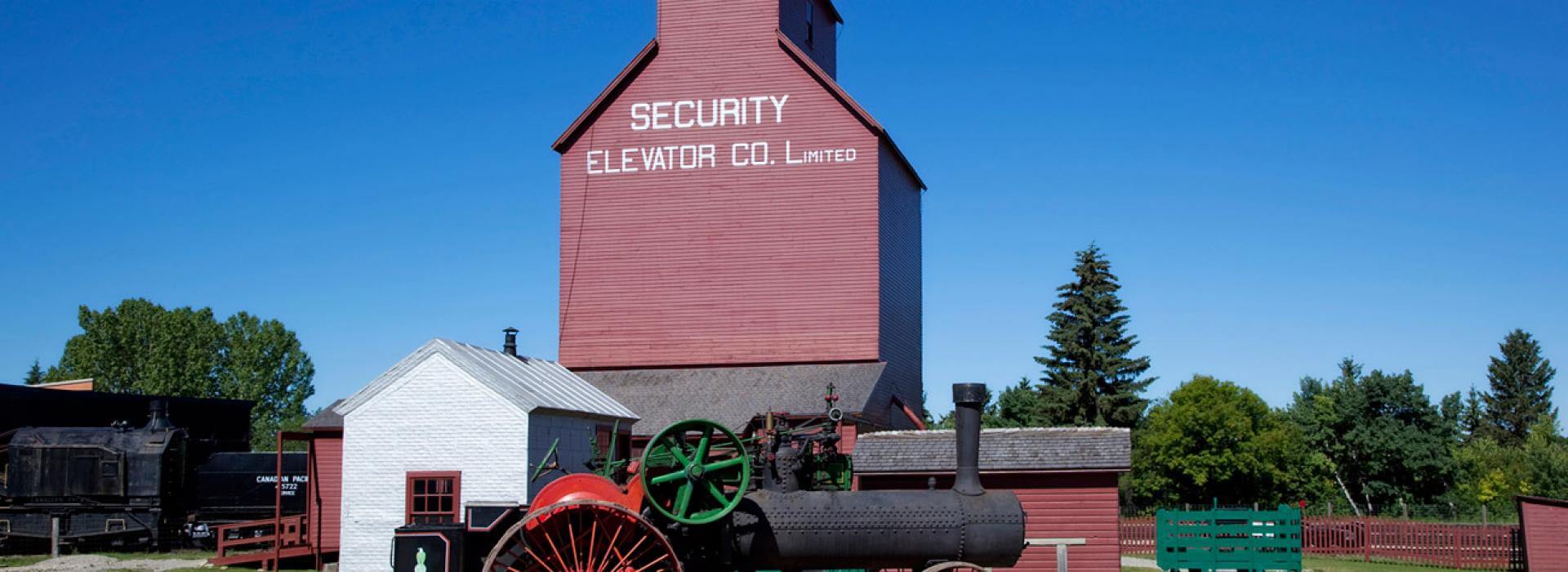 large red building with sign saying Security Gain Elevator