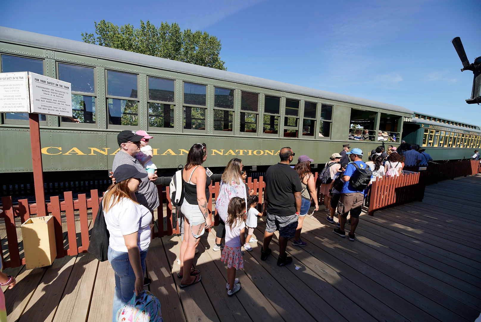Guests board the train at Heritage Park's Midnapore Station, located in the Historical Village