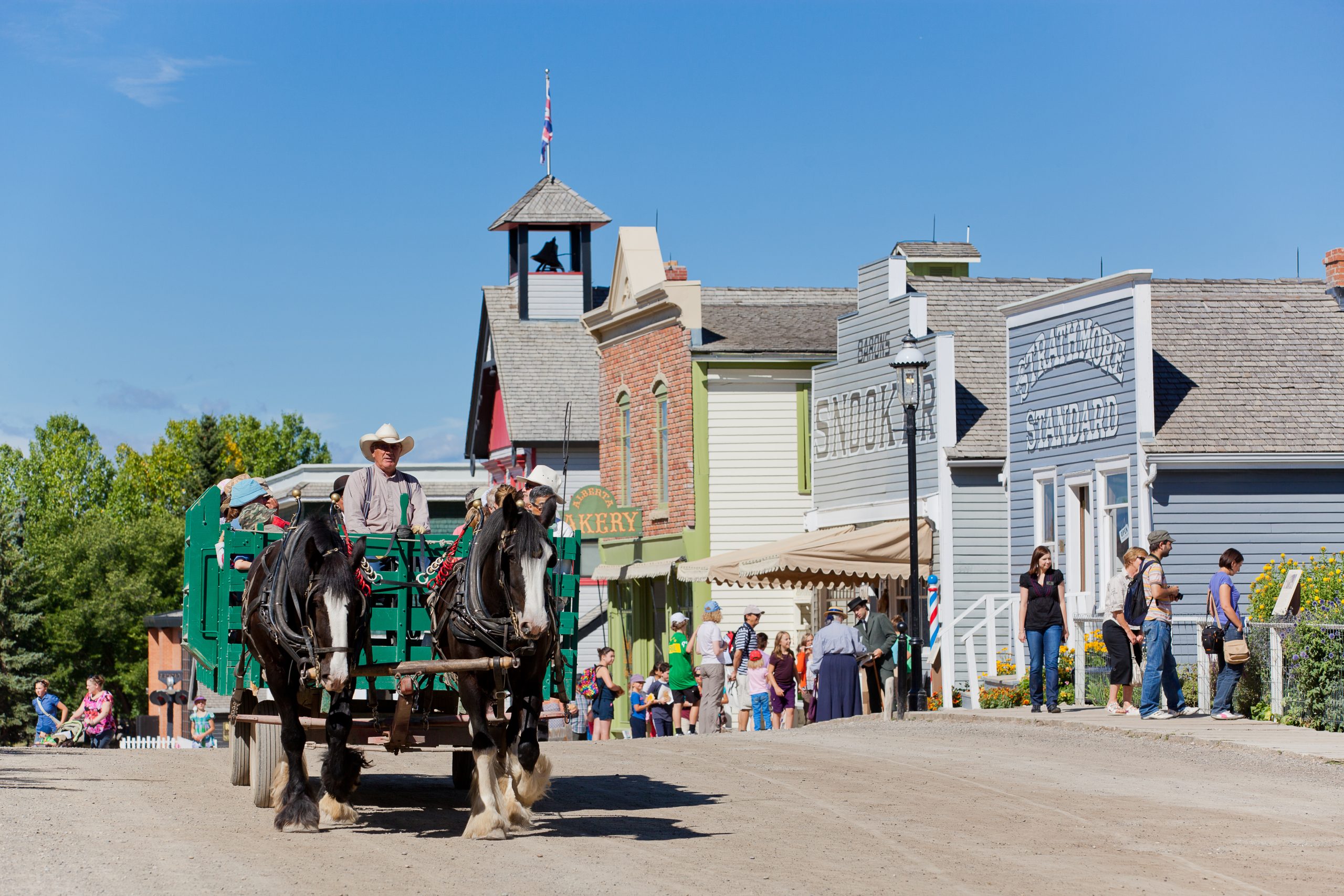 Guests go for a wagon ride within the Historical Village at Heritage Park