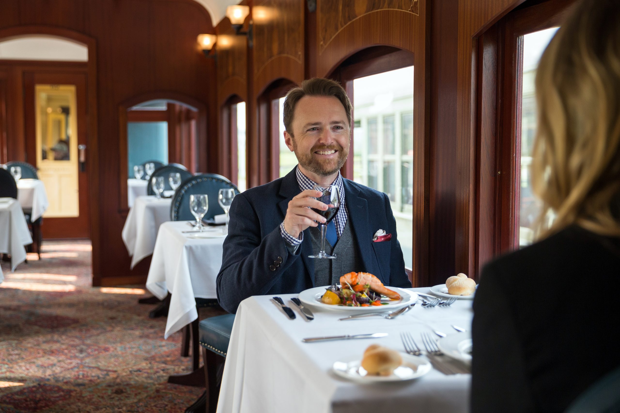 A couple enjoys lunch on the River Forth Dining Car at Heritage Park