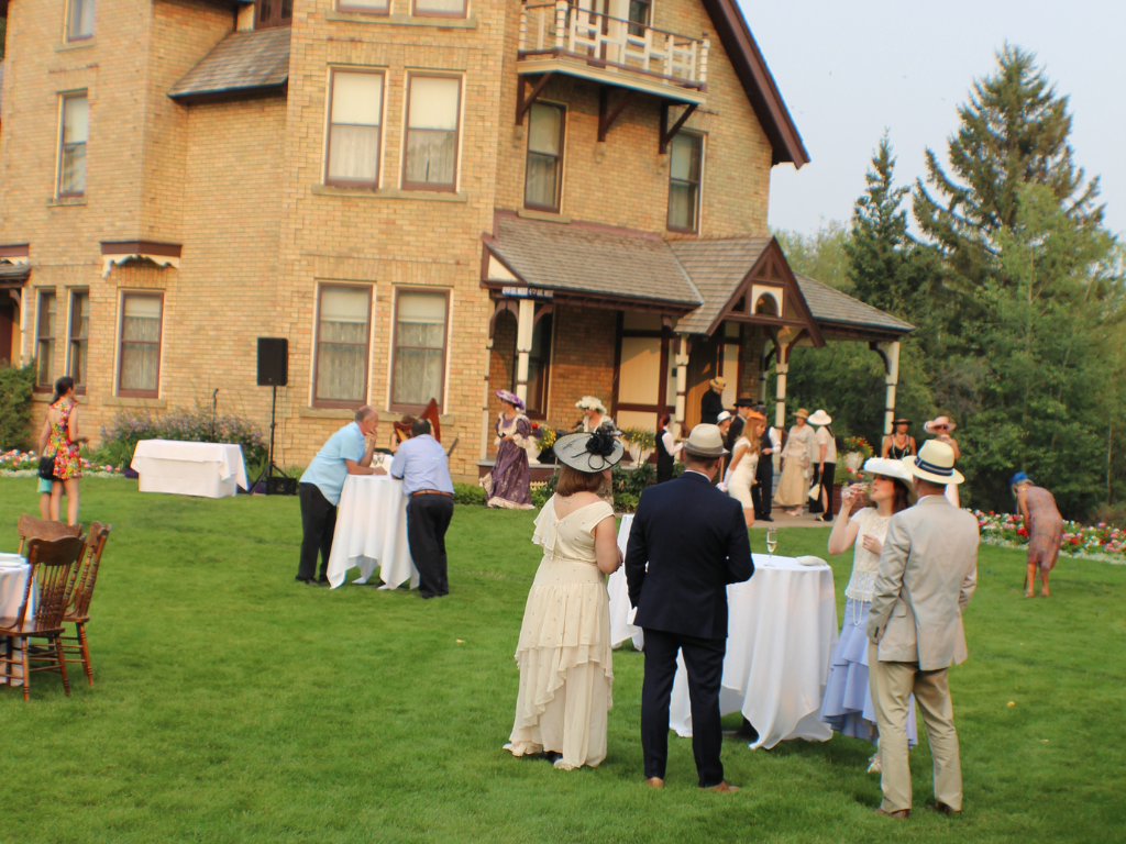 People enjoy the Prince House Lawn Dinner at Heritage Park in Calgary