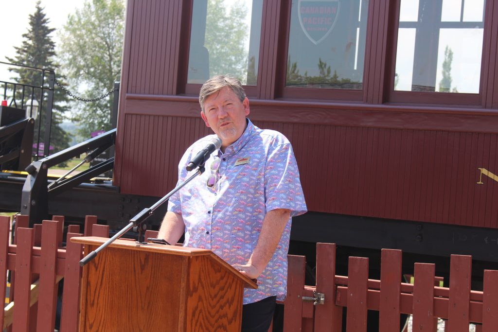 President and CEO of Heritage Park, Lindsey Galloway, giving a speech at the unveiling of the new accessible railcar.