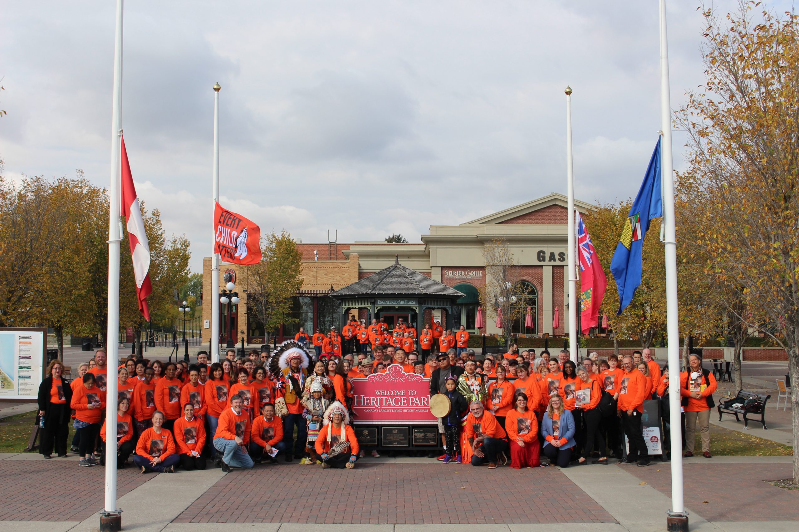 Heritage Park staff gathered in the plaza with Orange Shirts